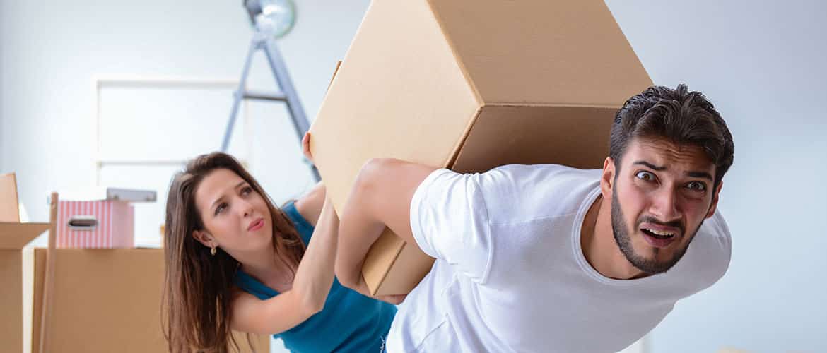 Carrying Heavy Box — The Removals Group in Burleigh Heads, QLD