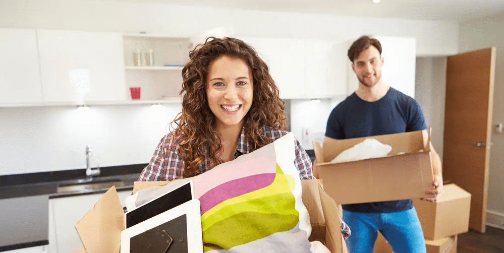 Couple Moving Into New House — The Removals Group in Burleigh Heads, QLD