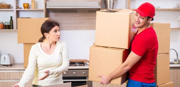 Man Helping Woman Move - The Removals Group In Gold Coast, QLD